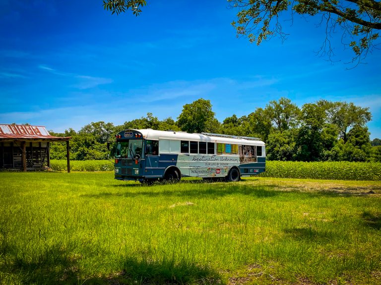 Skoolie parked in sunflower field | Magical Skoolie Glamping In A Sunflower Field | Pitts, Georgia, USA