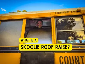 Man inserting a sheet metal frame into school bus window frame | what is a skoolie roof raise? | Destination Unknown
