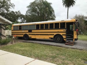 Retired school bus built by Thomas Built Buses. Some windows have been replaced with sheet metal and the bus is in process of turning into a skoolie or converted motorhome.