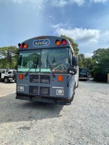 Hildebus Skoolie parking in a national park during the day